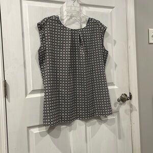 Women’s size 1X blouse with black and grey designs. Comes from a smoke free home